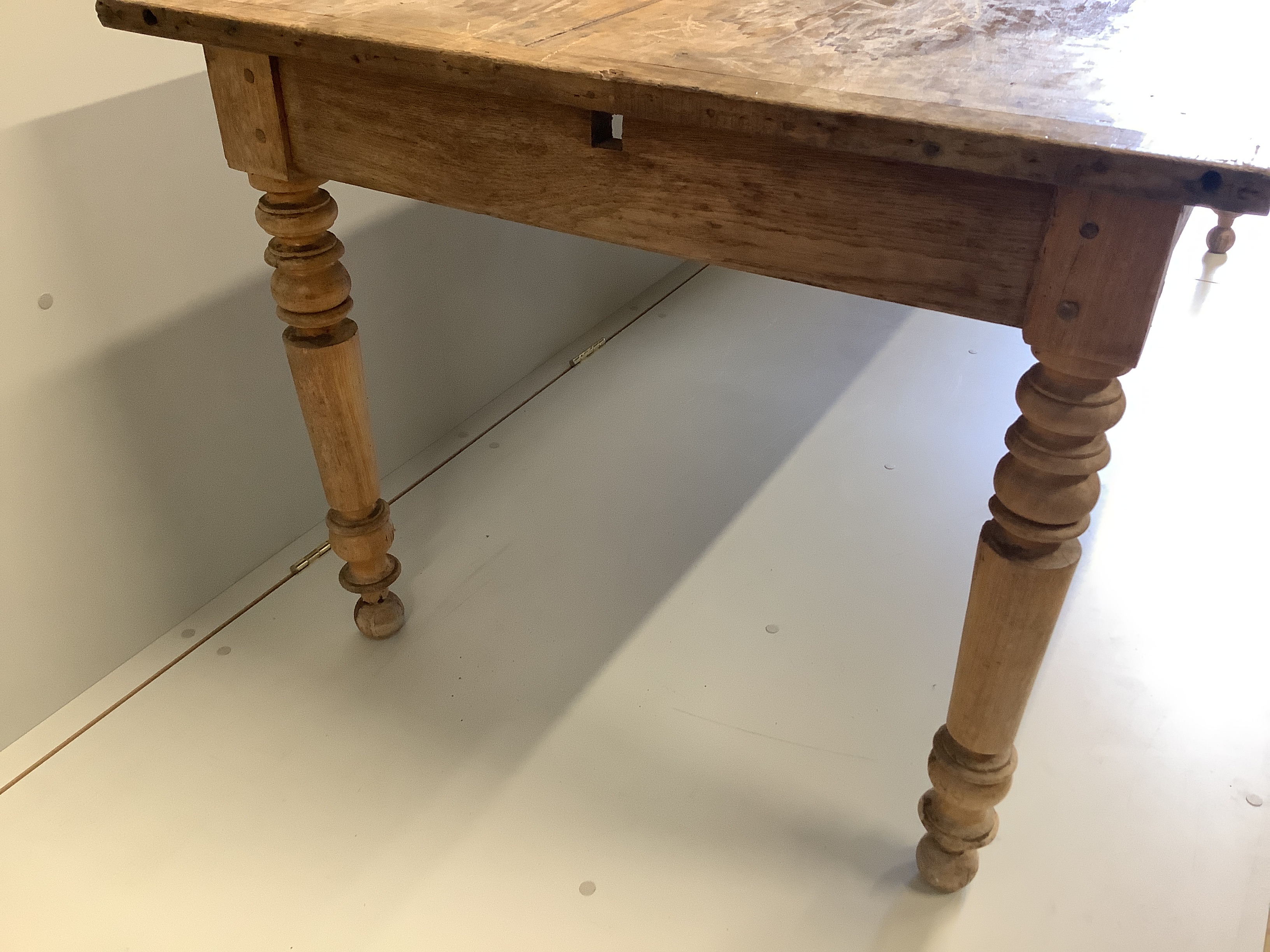 A 19th century French rectangular oak and fruitwood kitchen table, fitted drawer, width 202cm, depth 90cm, height 74cm